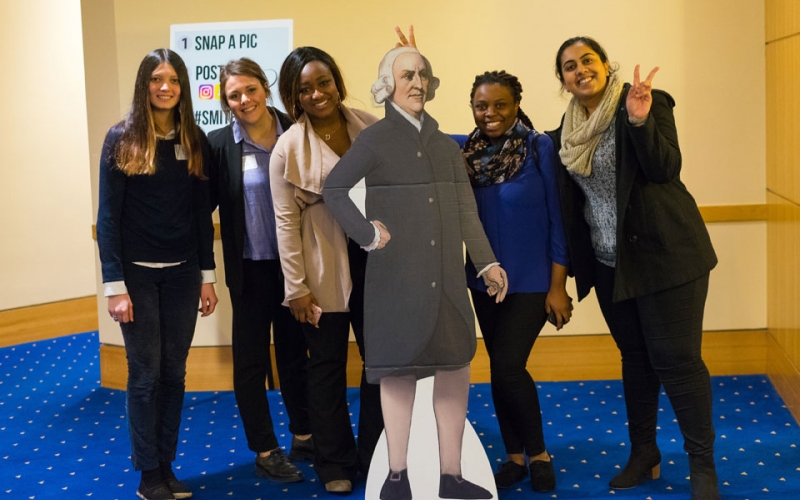 A group of students pose with Adam Smith, a prominent philosopher who laid the foundations of classical free market economic thinking, as part of the #SMITHSELFIE campaign.